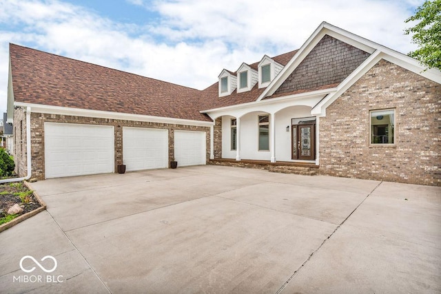 720 Willow Pointe N Dr, Plainfield, IN 46168 - view of front facade with covered porch, driveway, a garage, brick siding, and a shingled roof
