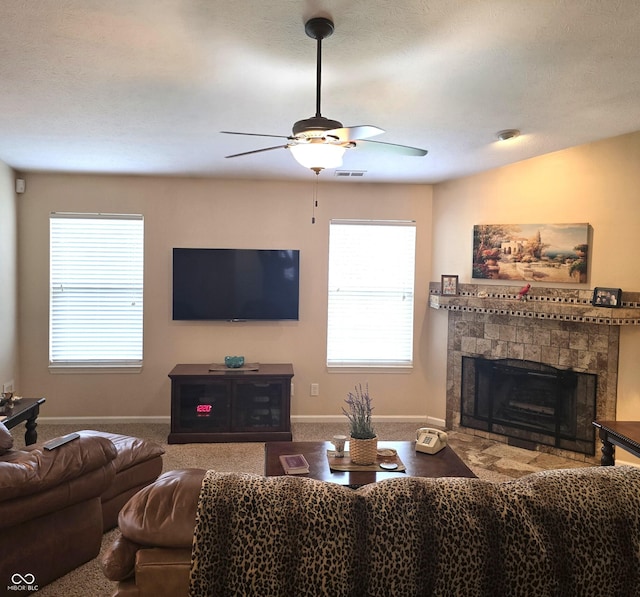 7608 Mather Ln, Indianapolis, IN 46239 - carpeted living area with a ceiling fan, healthy amount of natural light, and a tiled fireplace
