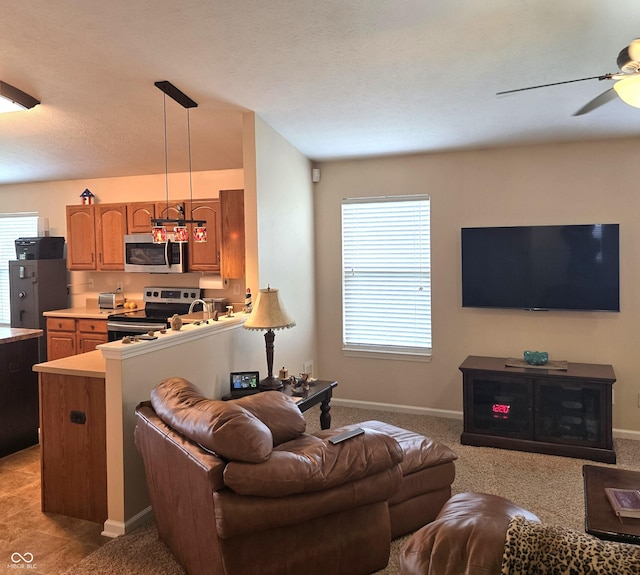 7608 Mather Ln, Indianapolis, IN 46239 - living room featuring a ceiling fan and baseboards