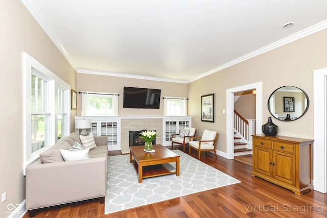 1325 Fordice Rd, Lebanon, IN 46052 - living area with ornamental molding, dark wood-type flooring, a brick fireplace, and stairway