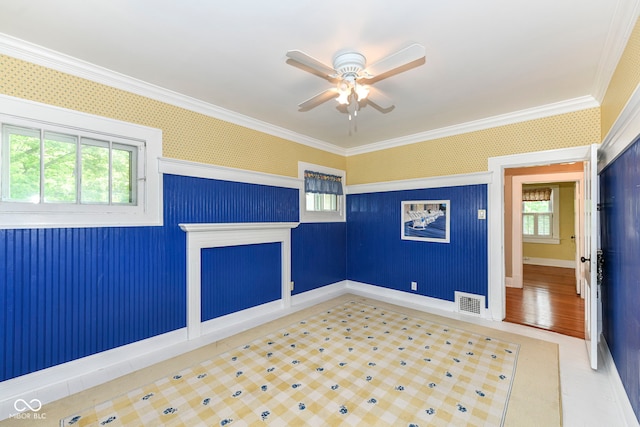 1325 Fordice Rd, Lebanon, IN 46052 - empty room featuring ornamental molding, ceiling fan, and wallpapered walls