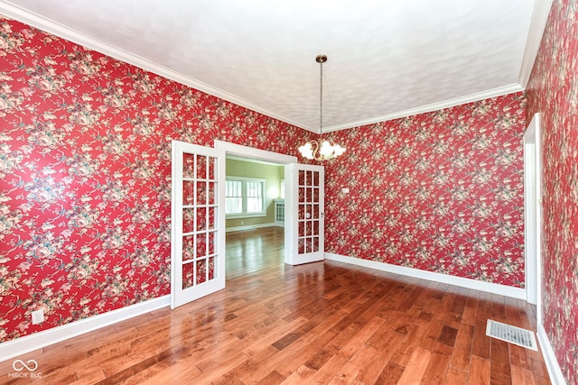 1325 Fordice Rd, Lebanon, IN 46052 - unfurnished dining area featuring hardwood / wood-style floors, wallpapered walls, and crown molding