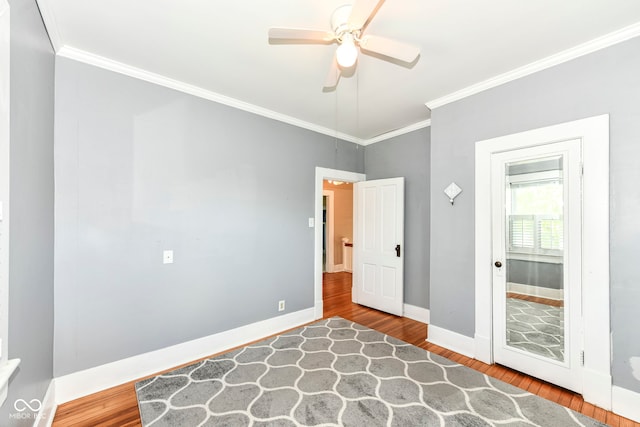 1325 Fordice Rd, Lebanon, IN 46052 - unfurnished bedroom featuring ornamental molding, wood finished floors, and ceiling fan