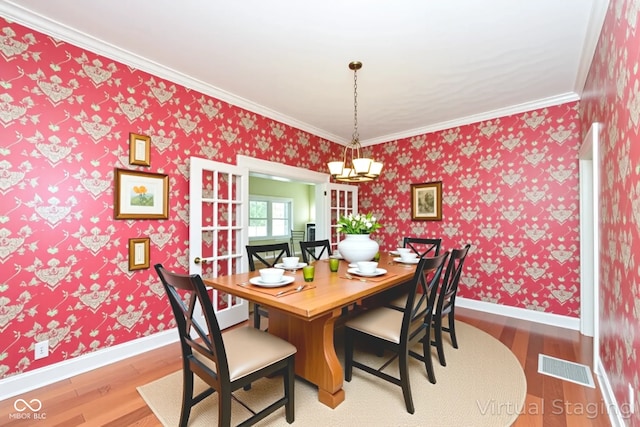 1325 Fordice Rd, Lebanon, IN 46052 - dining room with wood finished floors, ornamental molding, and wallpapered walls