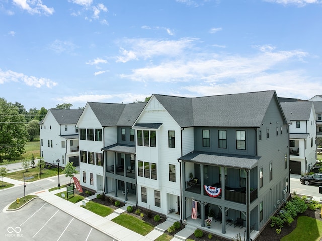 830 Freeland Way, Carmel, IN 46032 - exterior space featuring a shingled roof, uncovered parking, and a residential view