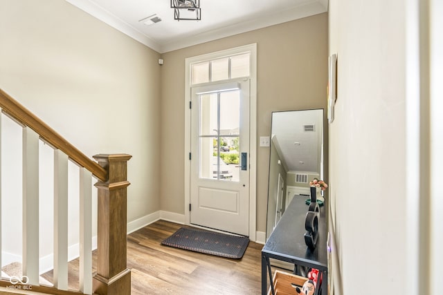830 Freeland Way, Carmel, IN 46032 - foyer entrance featuring wood finished floors, crown molding, and stairs