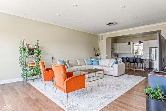 830 Freeland Way, Carmel, IN 46032 - living room with ornamental molding, light wood-type flooring, and recessed lighting