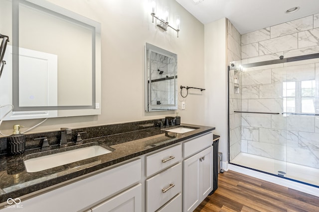 830 Freeland Way, Carmel, IN 46032 - full bathroom featuring a stall shower, double vanity, and wood finished floors