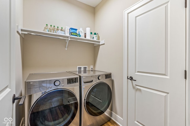830 Freeland Way, Carmel, IN 46032 - washroom with washer and dryer and wood finished floors