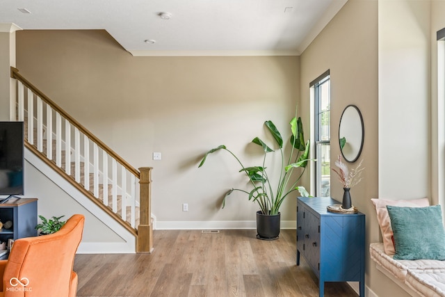 830 Freeland Way, Carmel, IN 46032 - entrance foyer with wood finished floors, stairs, and crown molding