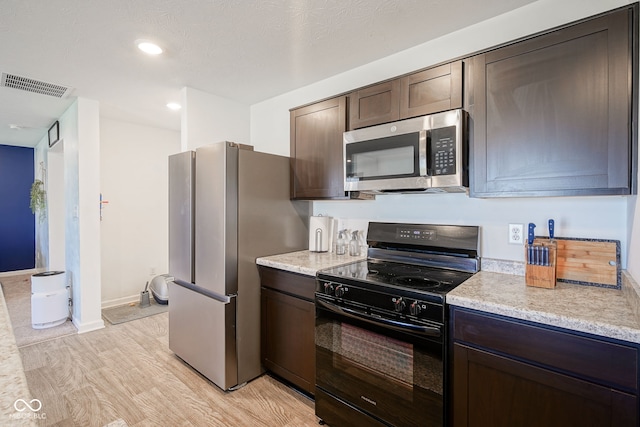 507 Redvine Dr, Sheridan, IN 46069 - kitchen featuring appliances with stainless steel finishes, dark brown cabinetry, light wood-type flooring, and recessed lighting