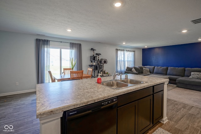 507 Redvine Dr, Sheridan, IN 46069 - kitchen featuring black dishwasher, dark wood-type flooring, open floor plan, recessed lighting, and a textured ceiling