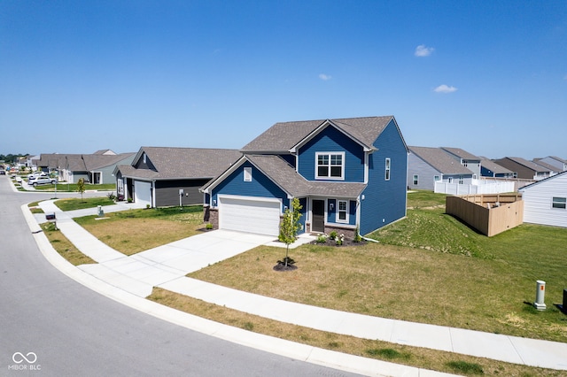 507 Redvine Dr, Sheridan, IN 46069 - traditional-style house with driveway, a front lawn, a garage, and a residential view