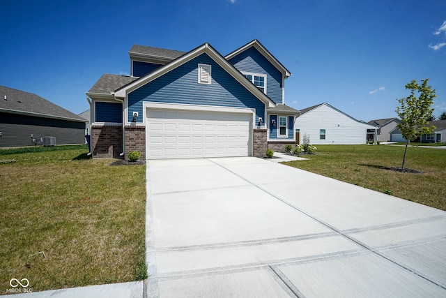 507 Redvine Dr, Sheridan, IN 46069 - view of front of home featuring brick siding, a garage, a front lawn, and driveway