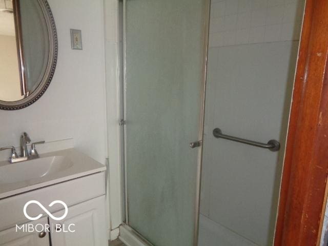 3253 W 34th St, Indianapolis, IN 46222 - bathroom with vanity and a stall shower