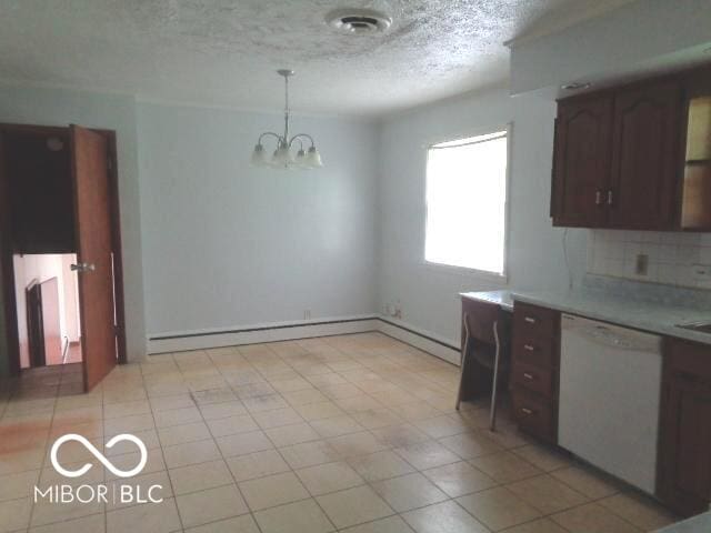 3253 W 34th St, Indianapolis, IN 46222 - kitchen with dishwasher, light countertops, a chandelier, a textured ceiling, and decorative backsplash