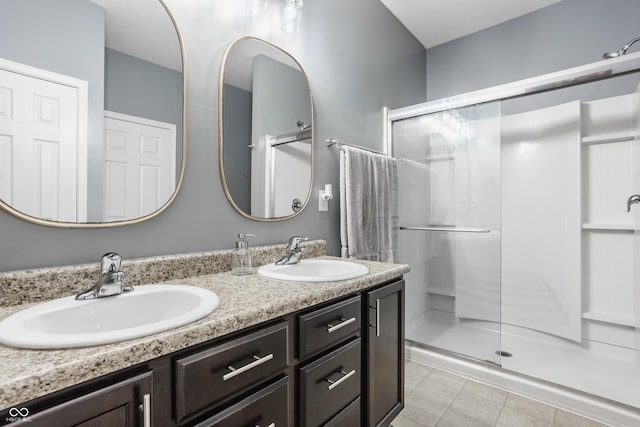 17183 Petersfield Ln, Westfield, IN 46074 - full bathroom with double vanity, a stall shower, and tile patterned flooring
