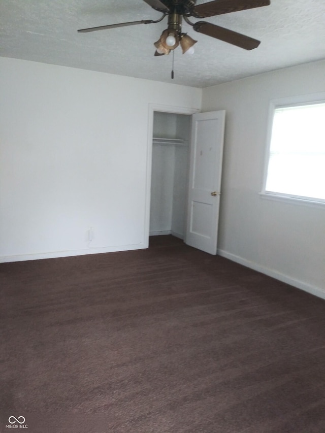 2138 Admiral Dr, Indianapolis, IN 46219 - unfurnished bedroom with a closet, ceiling fan, and a textured ceiling