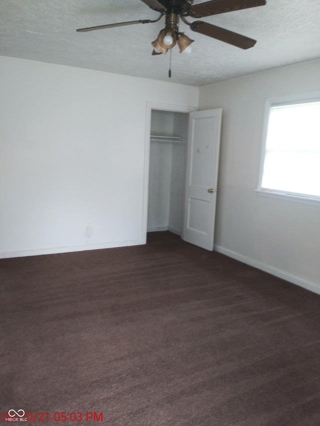 2138 Admiral Dr, Indianapolis, IN 46219 - unfurnished bedroom with a closet, a textured ceiling, and ceiling fan
