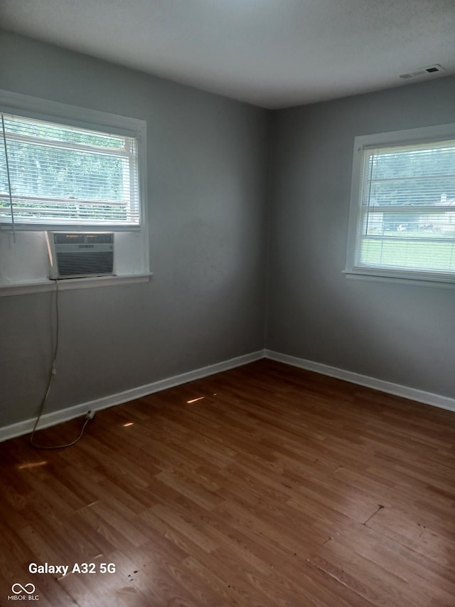 2138 Admiral Dr, Indianapolis, IN 46219 - unfurnished room featuring plenty of natural light, wood finished floors, and cooling unit