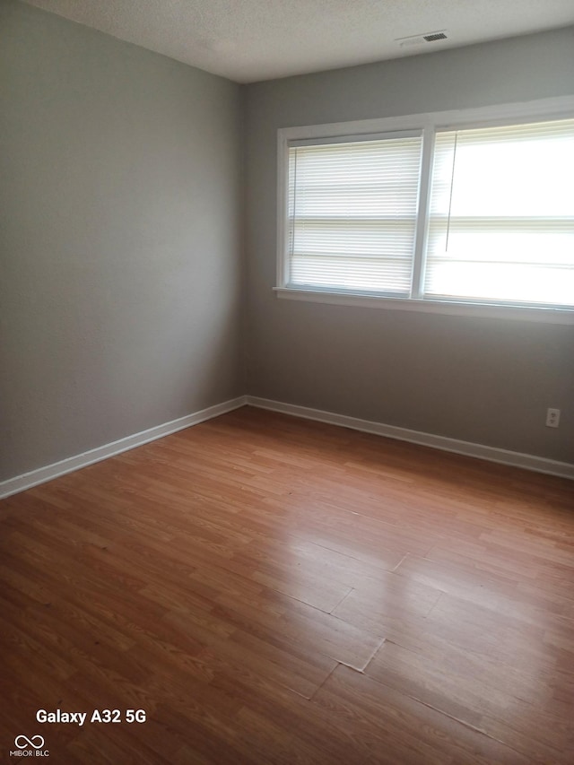 2138 Admiral Dr, Indianapolis, IN 46219 - unfurnished room with wood finished floors and baseboards