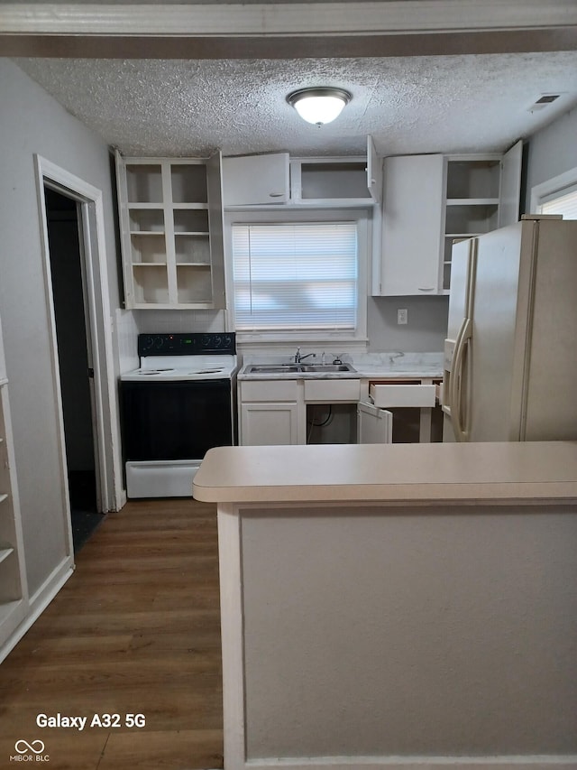2138 Admiral Dr, Indianapolis, IN 46219 - kitchen with range with electric stovetop, open shelves, white fridge with ice dispenser, white cabinets, and a textured ceiling