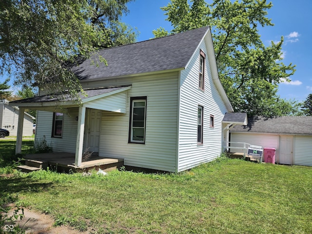 403 N Main St, Linden, IN 47955 - view of property exterior featuring a shingled roof, a lawn, and covered porch