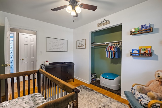 1302 N Furman Ave, Indianapolis, IN 46214 - bedroom featuring wood finished floors, a closet, and a ceiling fan