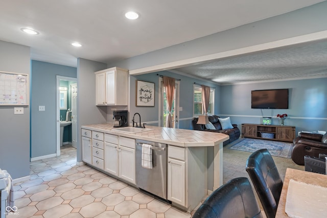 1302 N Furman Ave, Indianapolis, IN 46214 - kitchen featuring stainless steel dishwasher, open floor plan, tile counters, a peninsula, and recessed lighting