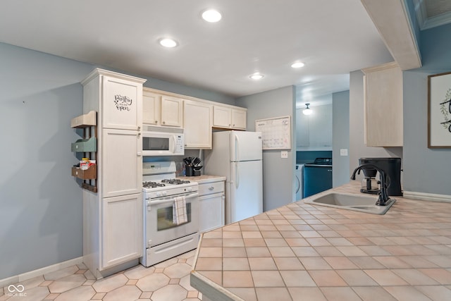 1302 N Furman Ave, Indianapolis, IN 46214 - kitchen with white appliances, recessed lighting, tile countertops, and washer and dryer