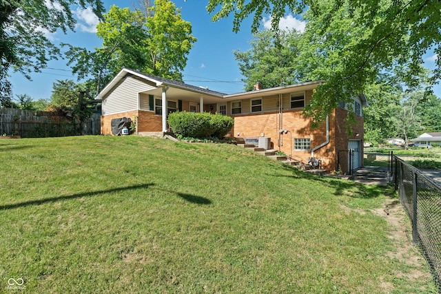 1302 N Furman Ave, Indianapolis, IN 46214 - rear view of property with brick siding, a fenced backyard, and a chimney