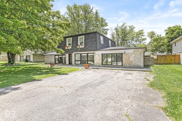 777 Sycamore St, Westfield, IN 46074 - view of front property featuring stone siding, mansard roof, and a shingled roof