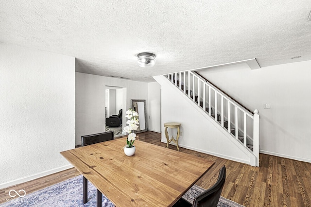777 Sycamore St, Westfield, IN 46074 - dining space with stairs, a textured ceiling, and wood finished floors