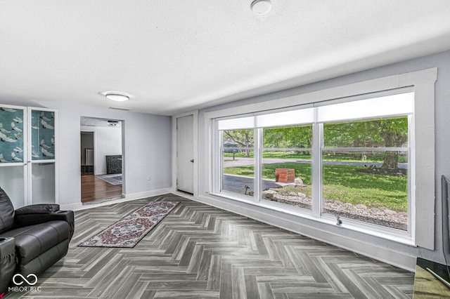 777 Sycamore St, Westfield, IN 46074 - unfurnished living room featuring baseboards and a textured ceiling