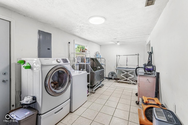 777 Sycamore St, Westfield, IN 46074 - laundry area with electric panel, washer and dryer, a textured ceiling, and light tile patterned flooring