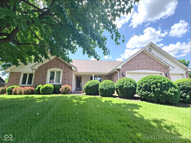3975 Keyway Dr, Greenwood, IN 46143 - single story home with an attached garage, brick siding, and a front lawn