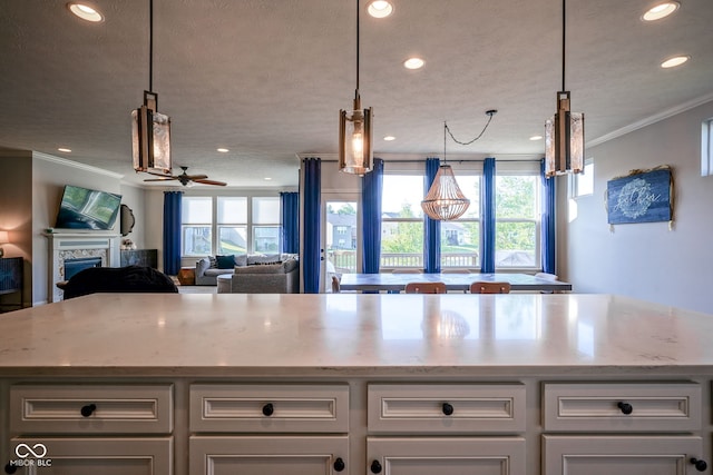 16235 Natures Way, Westfield, IN 46074 - kitchen featuring recessed lighting, crown molding, healthy amount of natural light, white cabinetry, and a ceiling fan