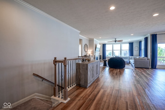 16235 Natures Way, Westfield, IN 46074 - living area featuring a textured ceiling, wood finished floors, ornamental molding, recessed lighting, and a ceiling fan