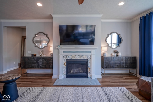 16235 Natures Way, Westfield, IN 46074 - living area with wood finished floors, recessed lighting, a tile fireplace, crown molding, and a textured ceiling