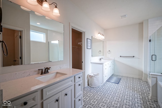 16235 Natures Way, Westfield, IN 46074 - bathroom featuring a shower with shower door, two vanities, tile patterned floors, and a bath