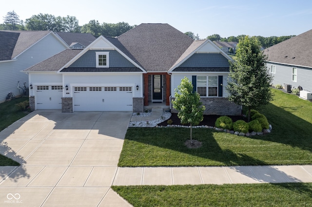 16235 Natures Way, Westfield, IN 46074 - craftsman-style house with an attached garage, concrete driveway, a front yard, and brick siding