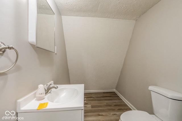 6570 N Private Road 525 E, North Vernon, IN 47265 - bathroom featuring a textured ceiling, wood finished floors, and vanity