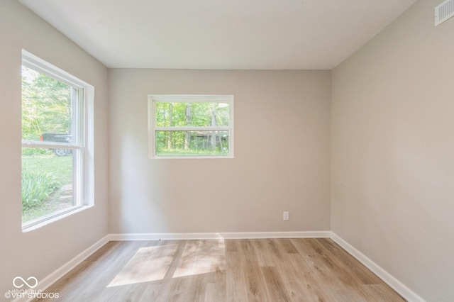 6570 N Private Road 525 E, North Vernon, IN 47265 - unfurnished room with light wood-type flooring and healthy amount of natural light