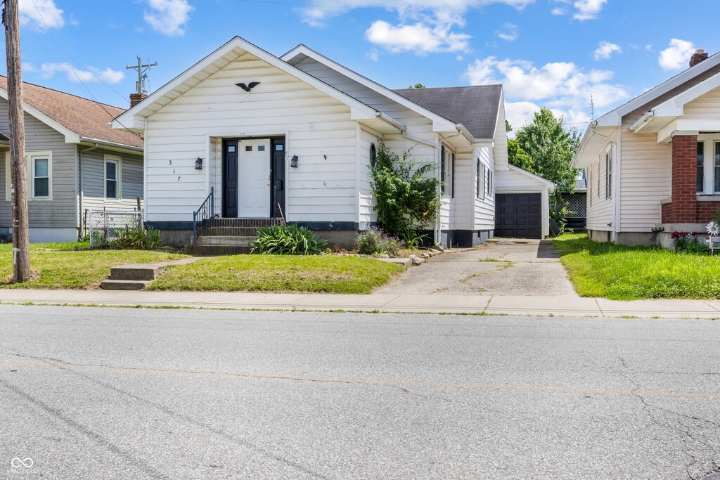 317 W 24th St, Connersville, IN 47331 - view of front of property with an outbuilding and entry steps