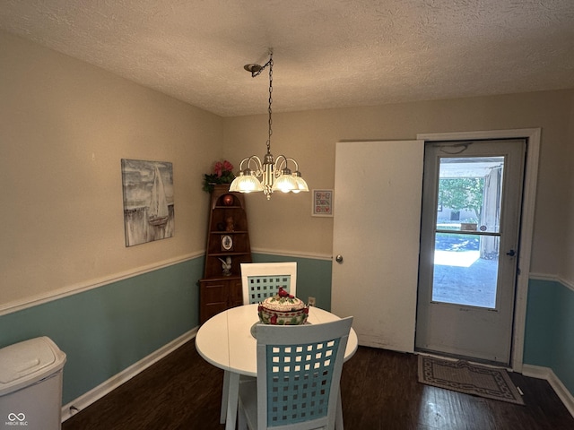 1001 Paradise Ct Unit F, Greenwood, IN 46143 - dining area featuring wood finished floors, a textured ceiling, and a chandelier