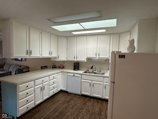 1001 Paradise Ct Unit F, Greenwood, IN 46143 - kitchen featuring white appliances, dark wood-style floors, white cabinetry, and a textured ceiling