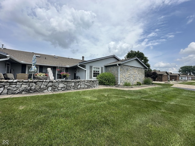 1001 Paradise Ct Unit F, Greenwood, IN 46143 - view of front facade with a front lawn and stone siding