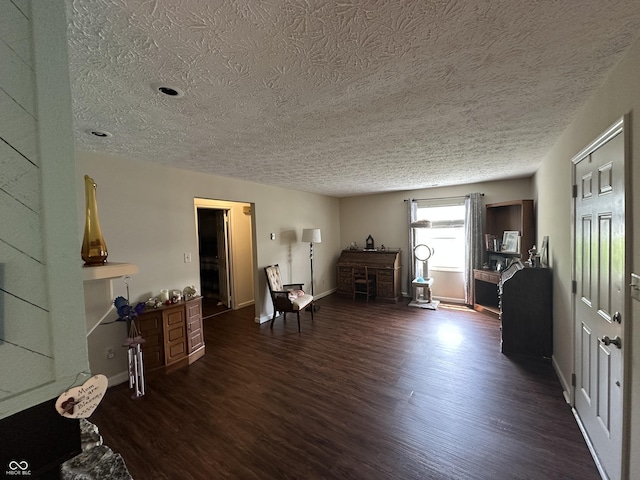 1001 Paradise Ct Unit F, Greenwood, IN 46143 - sitting room with a textured ceiling and dark wood-style flooring