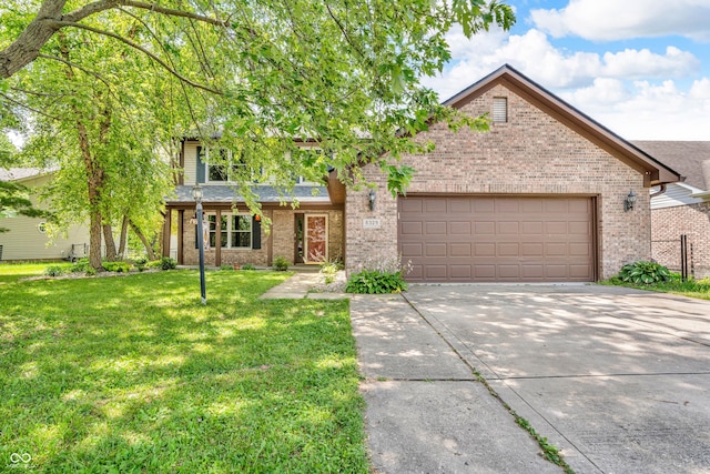 6329 Whitaker Farms Dr, Indianapolis, IN 46237 - view of front facade with brick siding, driveway, an attached garage, and a front yard