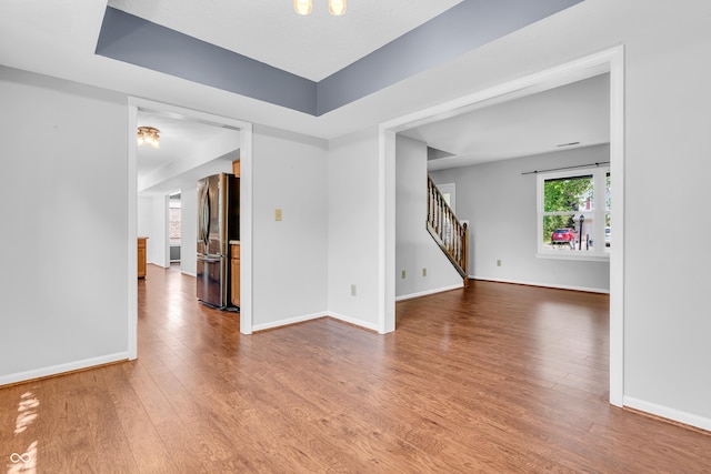 6329 Whitaker Farms Dr, Indianapolis, IN 46237 - empty room featuring wood finished floors and stairway